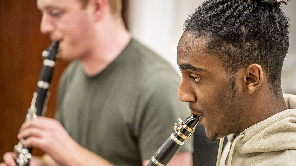 Two RCM clarinet players rehearsing together